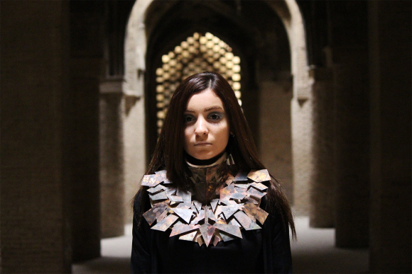 Feeling Human worn piece, full figure in an archway